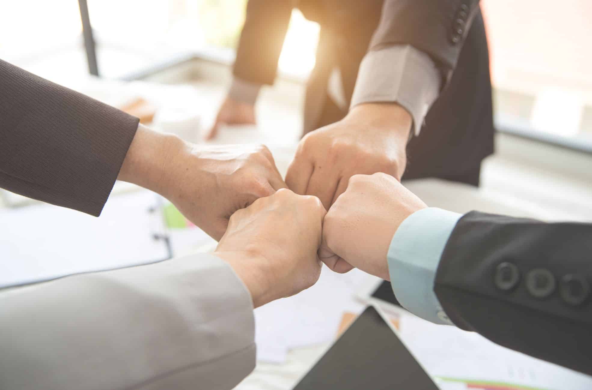 Business Men "Fist-Bumping"