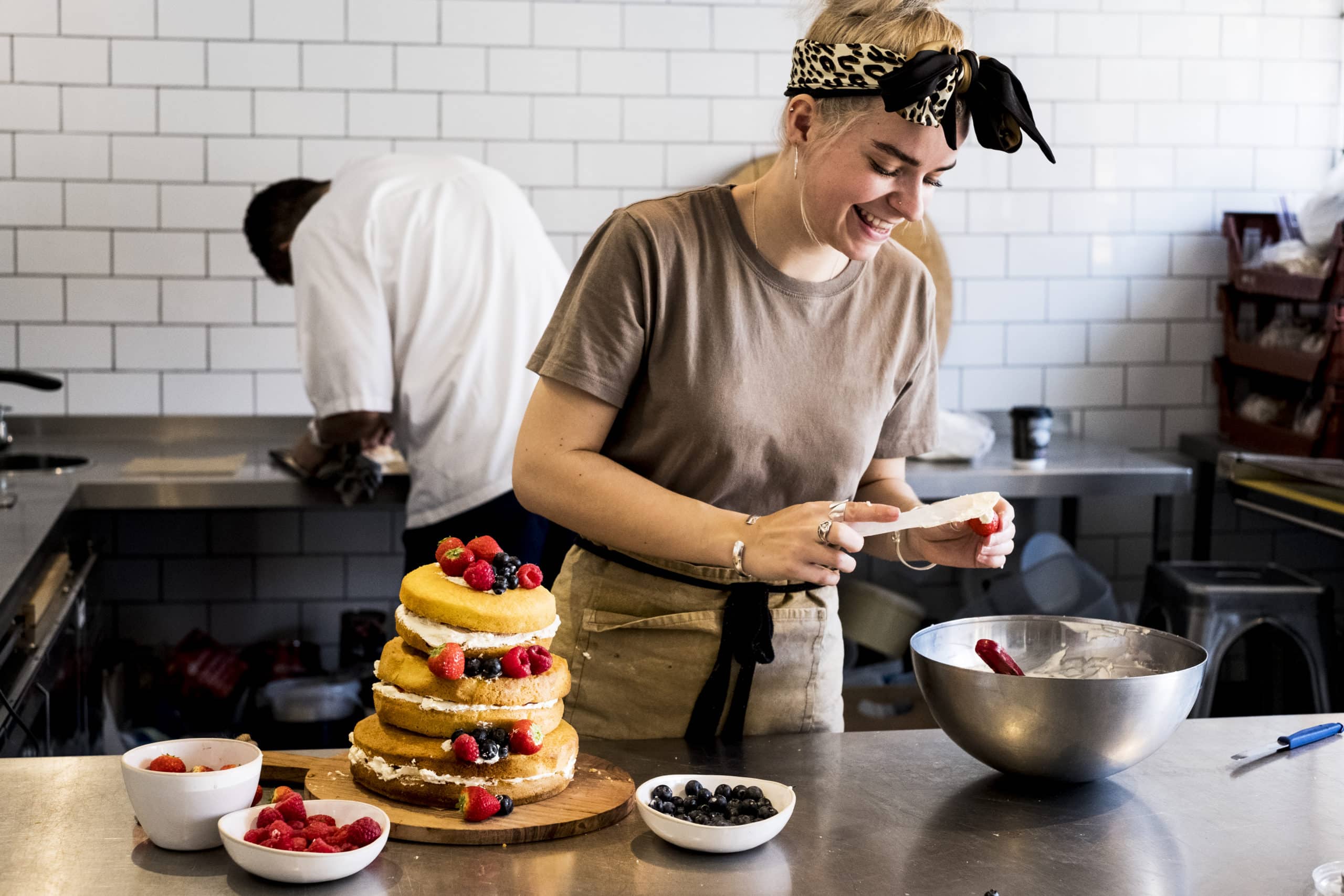 Chef preparing cake orders from cloud commercial kitchen