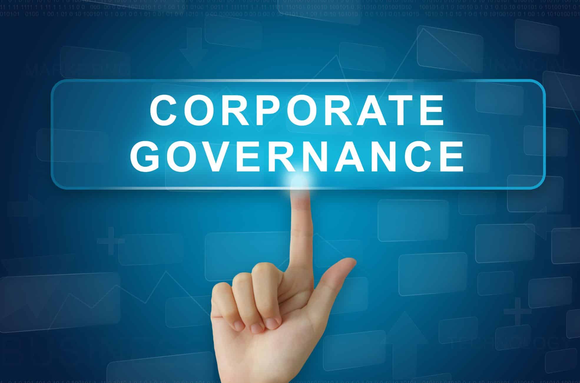 Hand Pointing To Sign Saying "Corporate Governance"