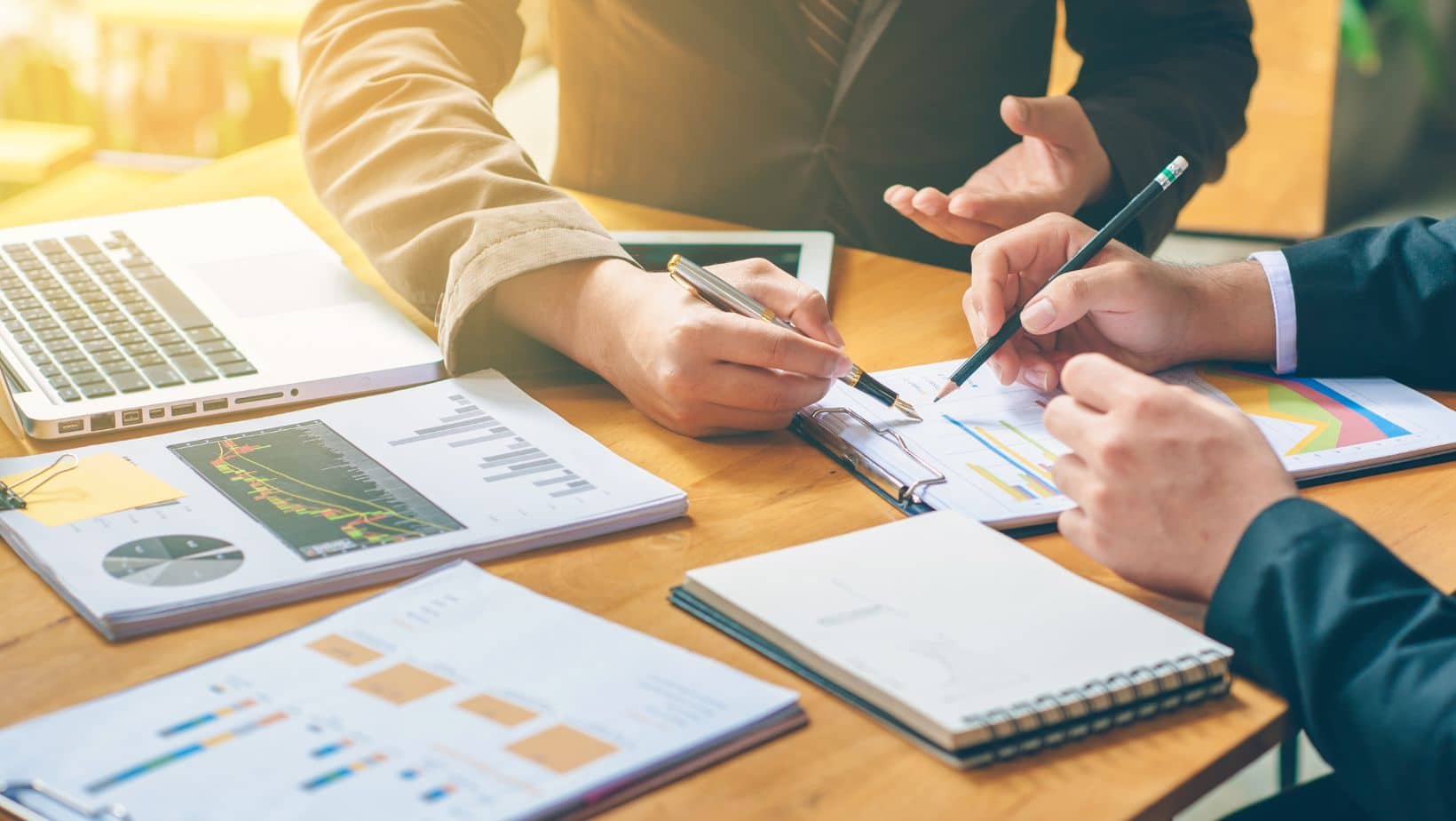 People Reviewing A Business Plan