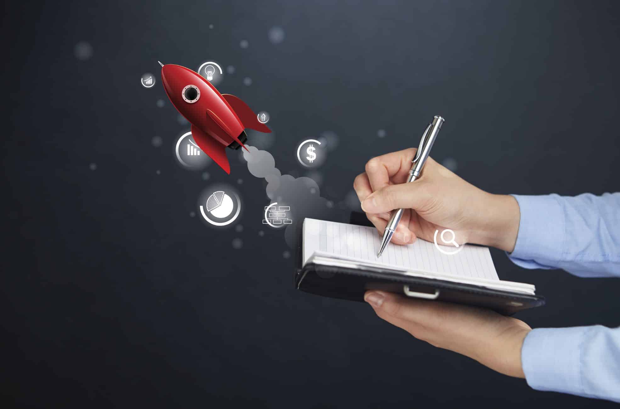 Man Writing Startup Business Plan On Tablet