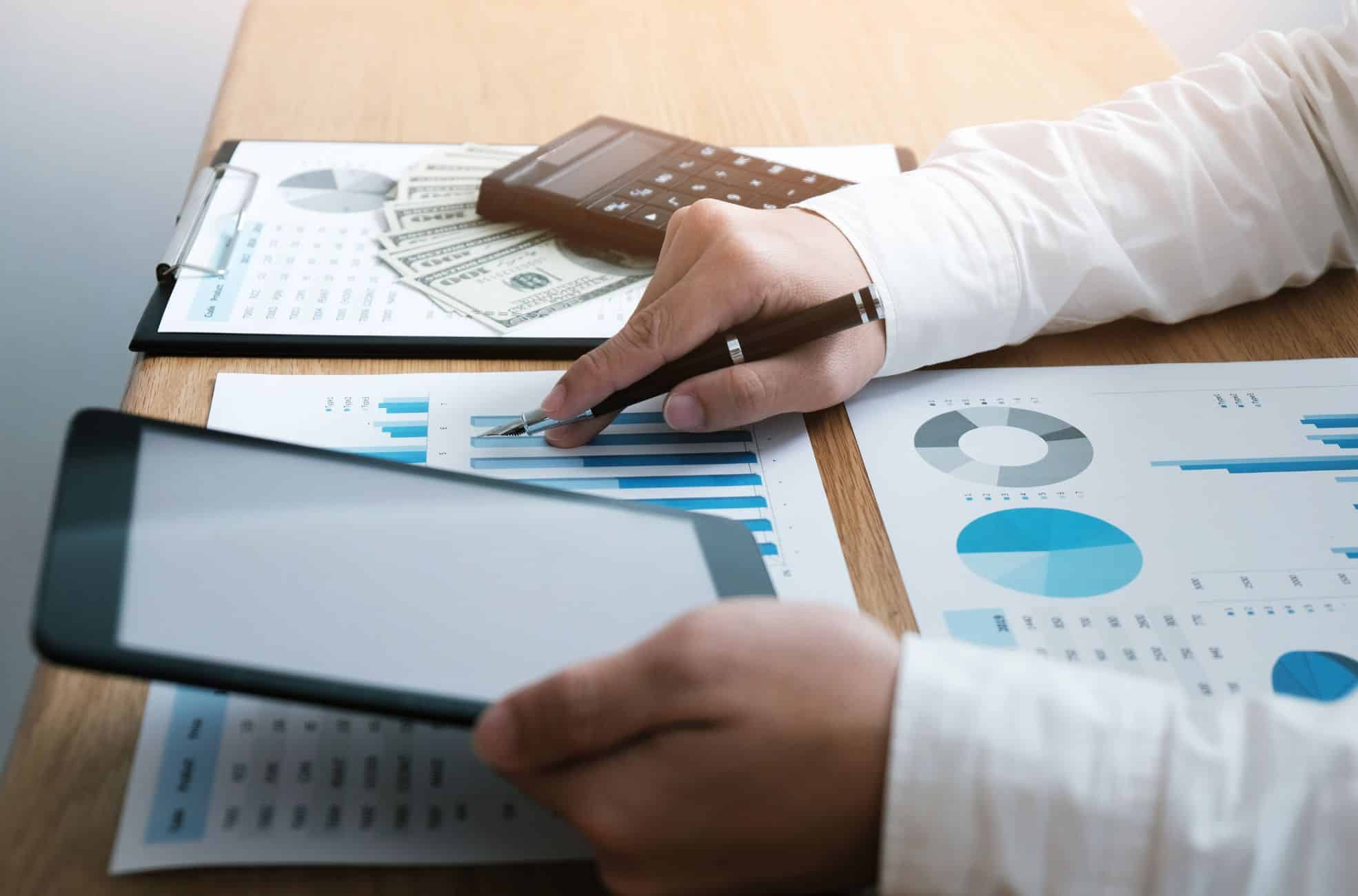 Person Doing Audit Work At Desk