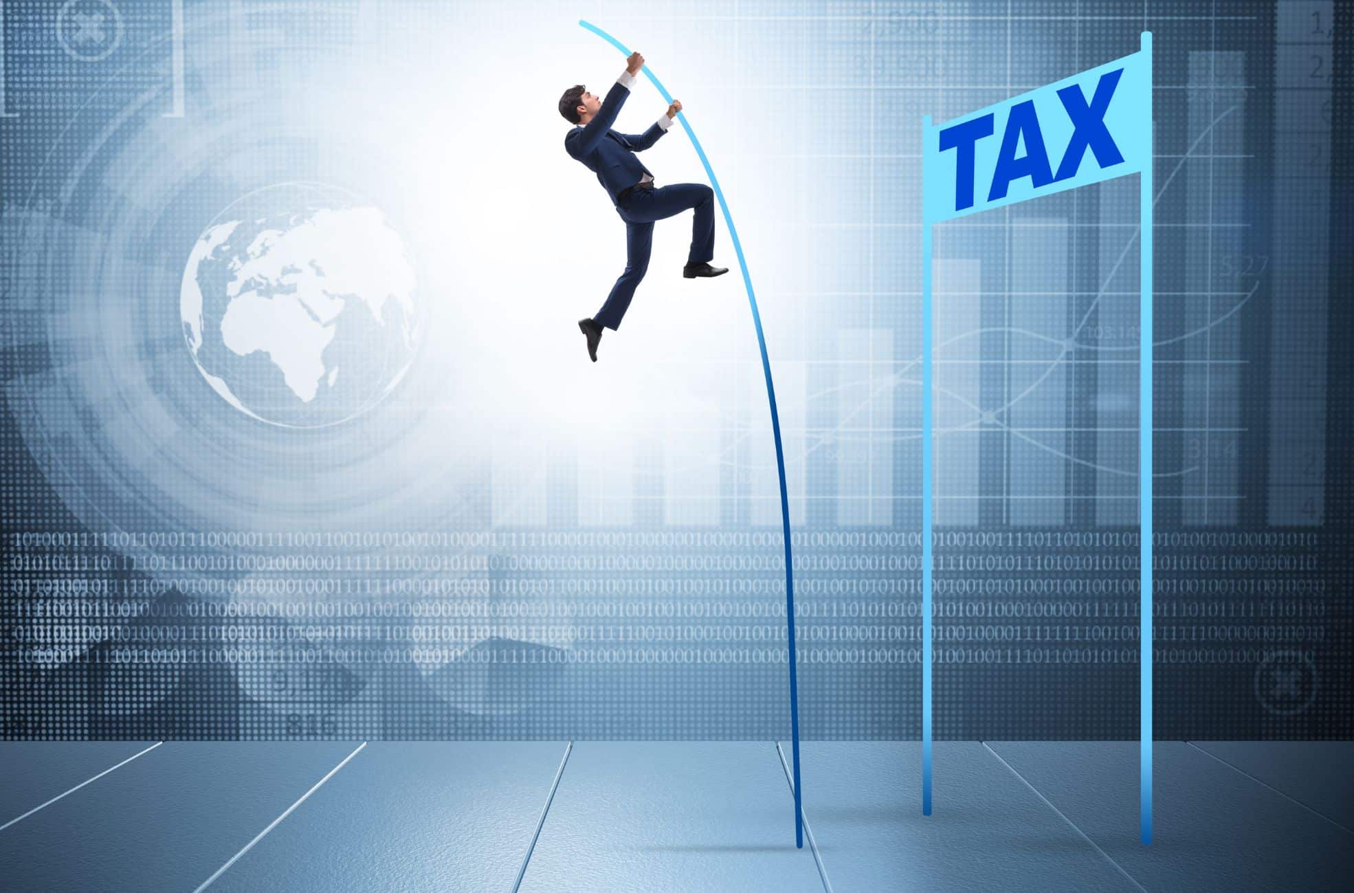 Man Going Over Tax Sign