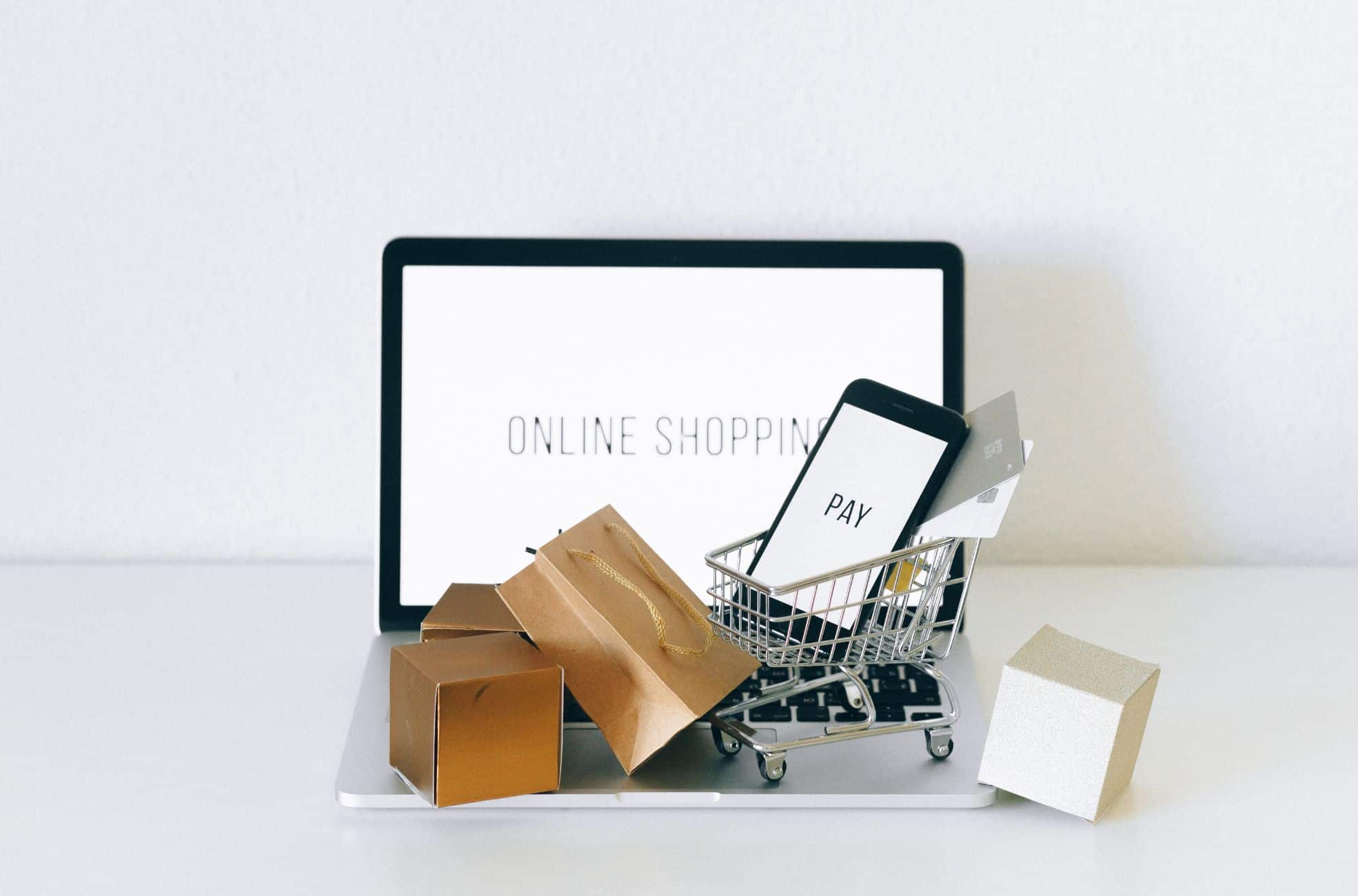 E-commerce Shown With Laptop And Shopping Items