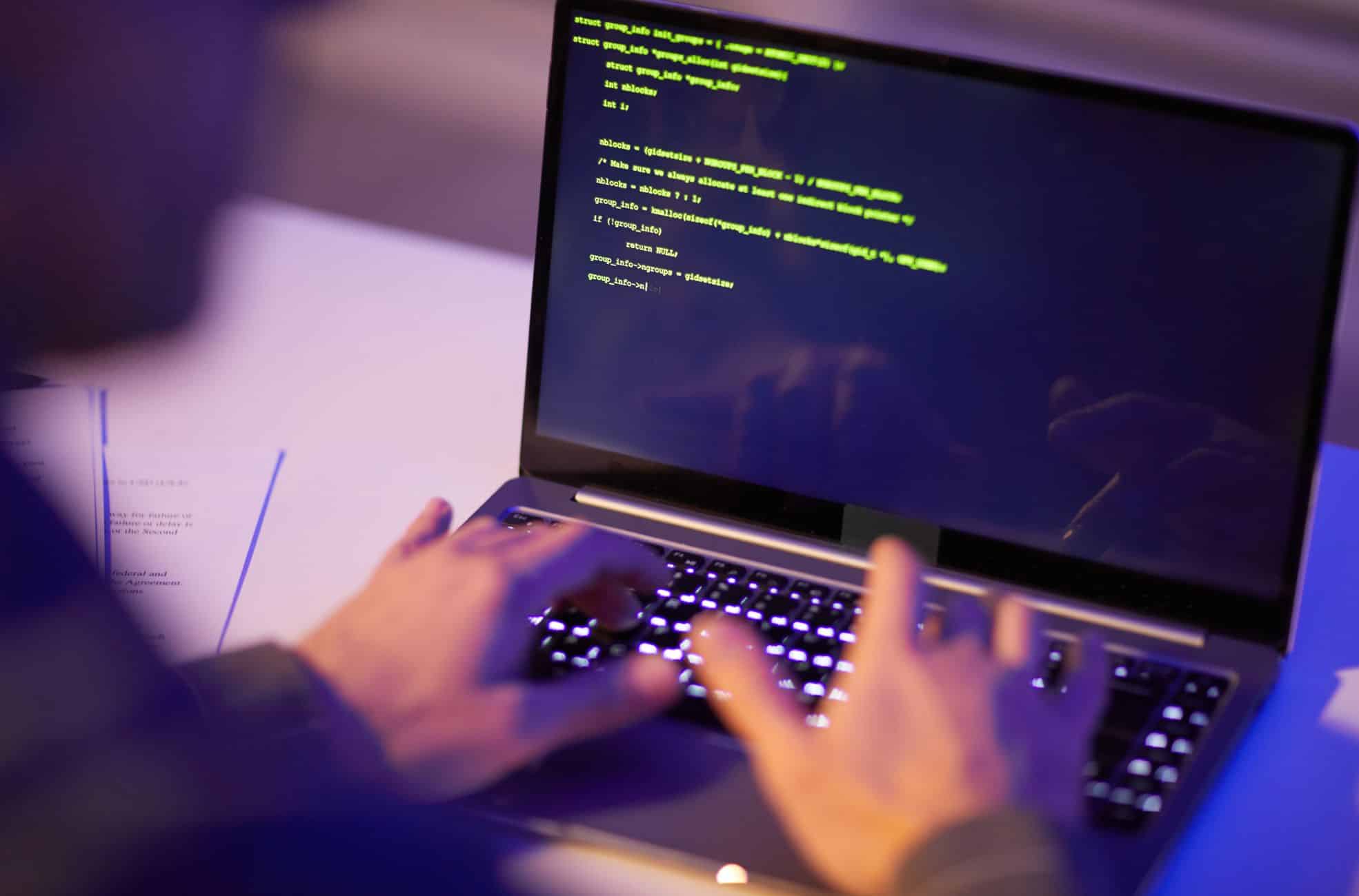 Person Coding On Macbook