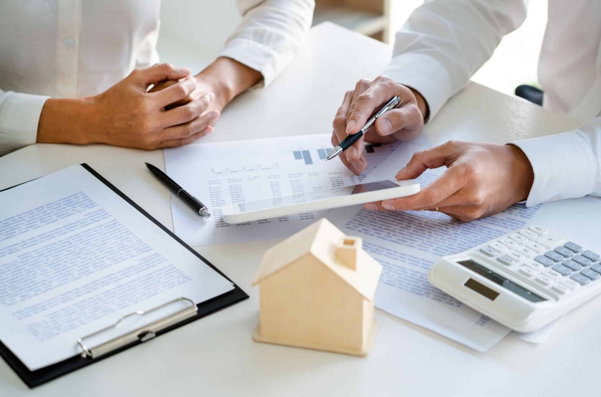 People Making A Real Estate Deal At Desk