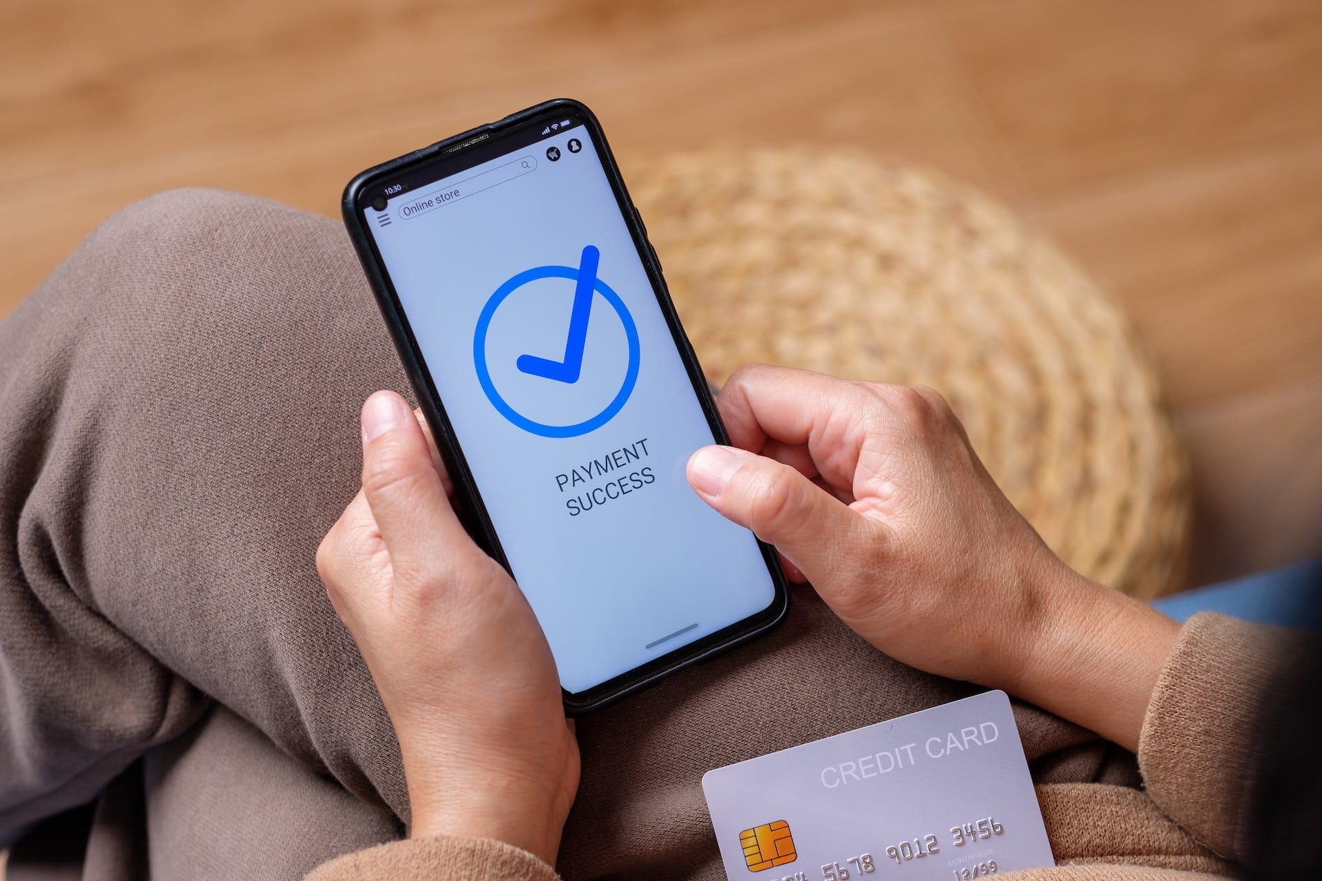 A stock image showing the sending and receiving of international payments on a phone.