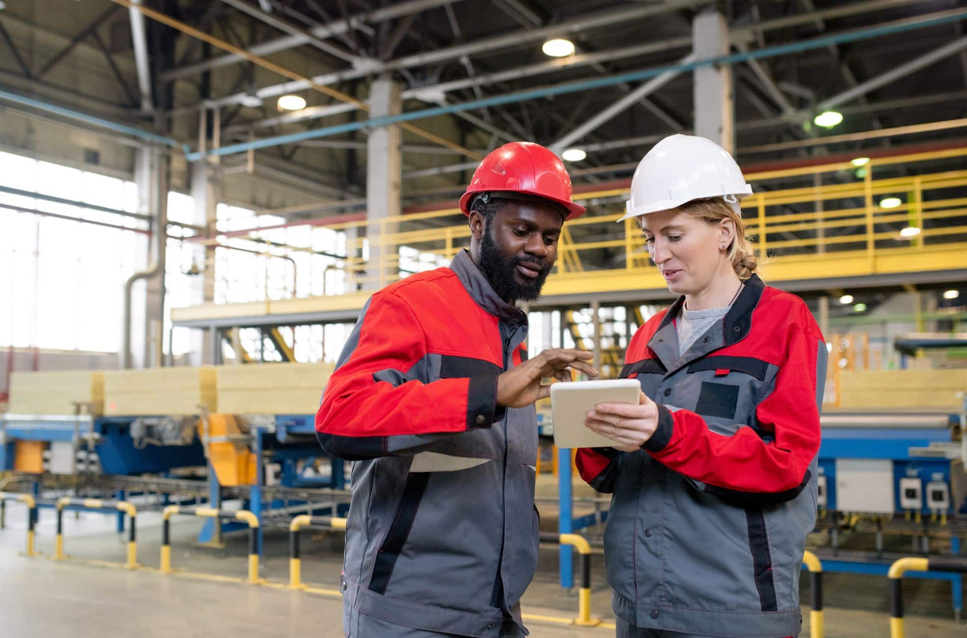 Stock Photo of Manufacturing Workers Working With A Licence