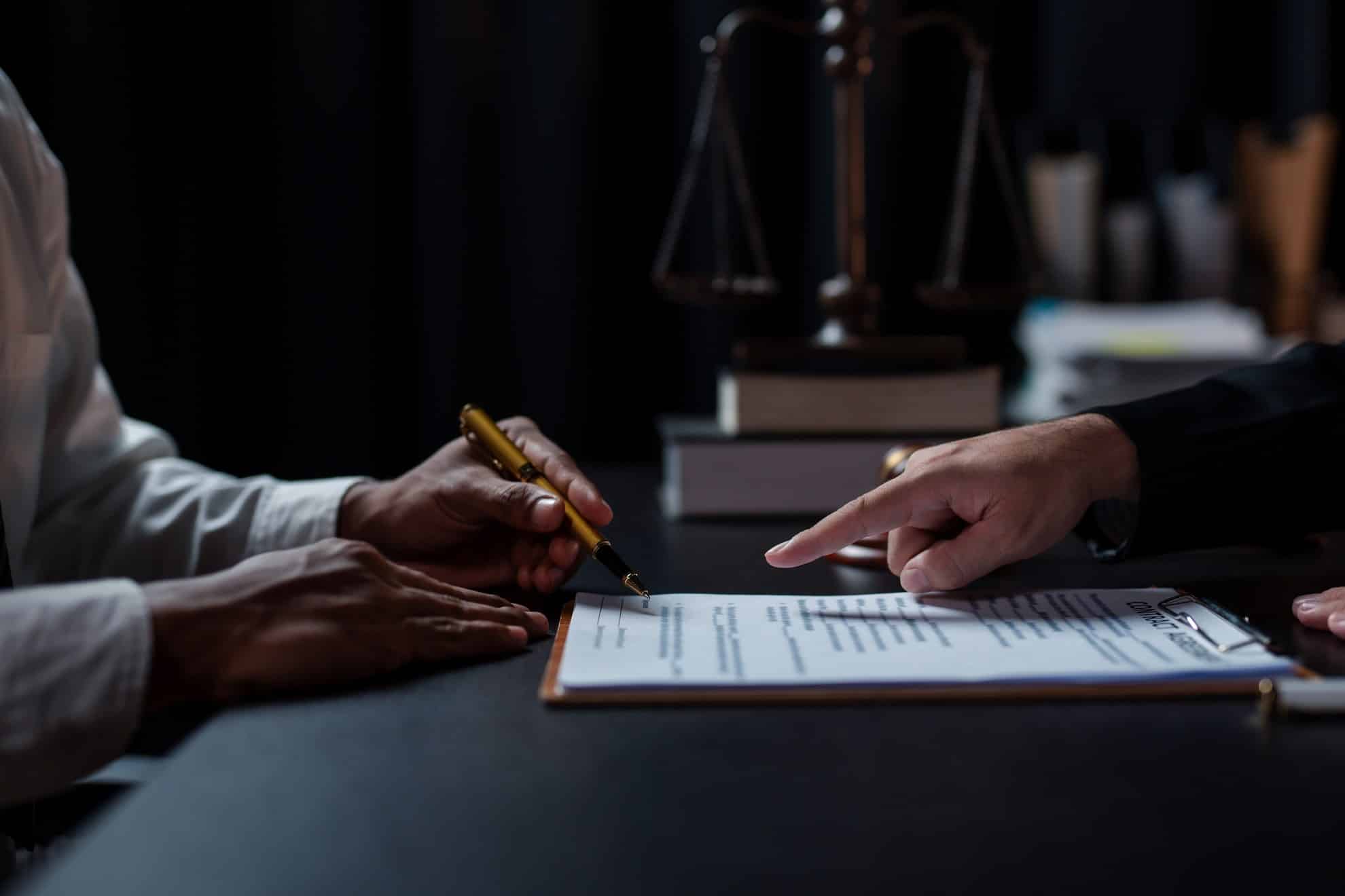 Two partners drafting a memorandum of association for their partnership in the UAE.