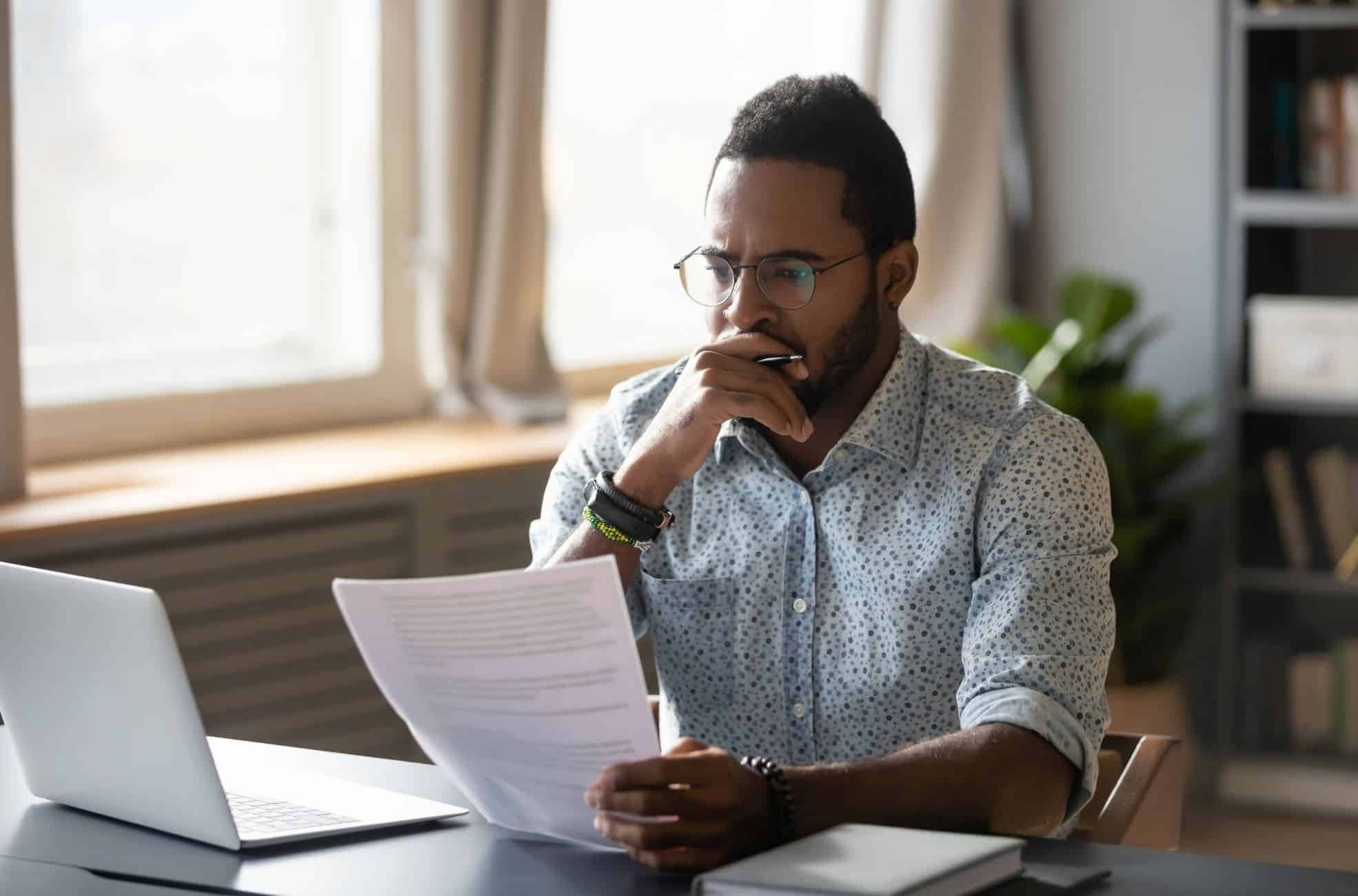 Business Man Looking At Paperwork