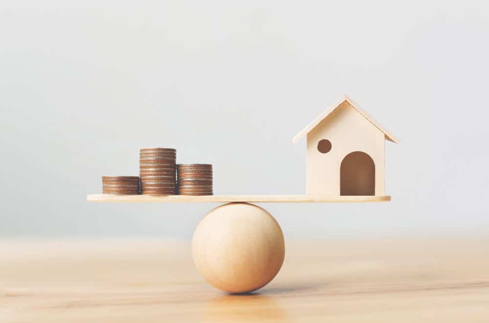 House And Money Balancing On Ball