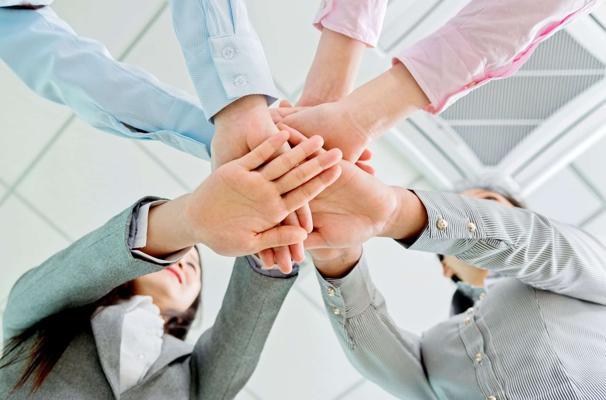 Work Team Touching Hands