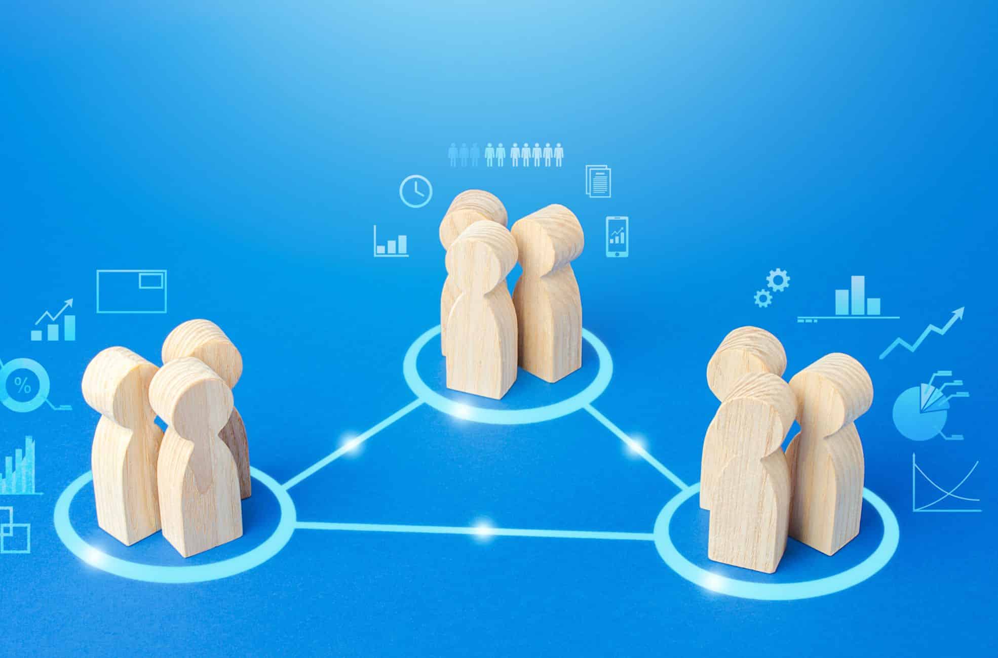 Wooden Figurines On Blue Background