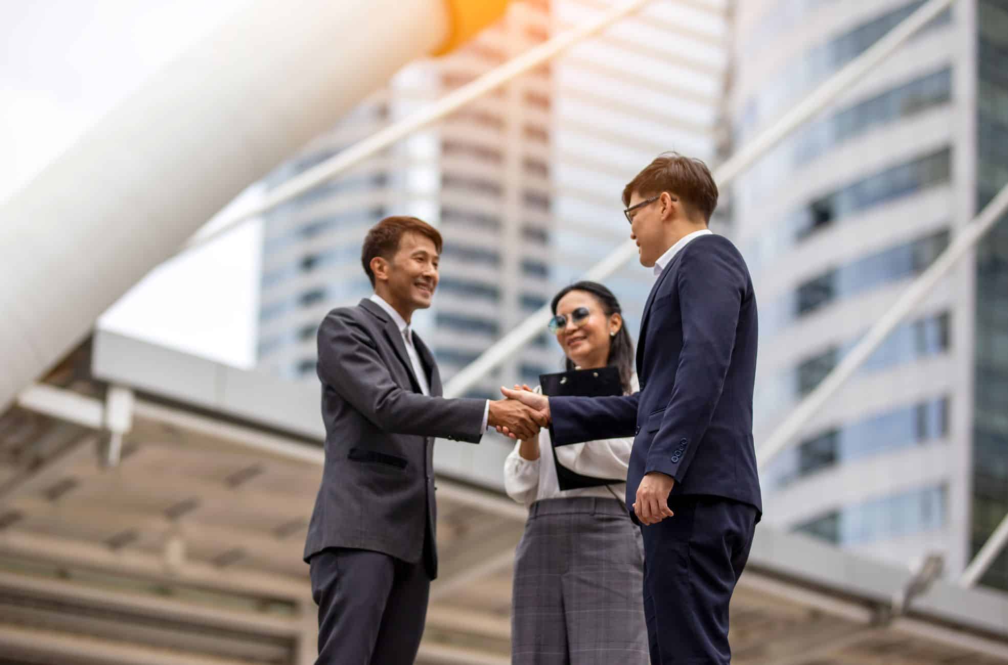 Stock Photo Business Partnership Between Three People