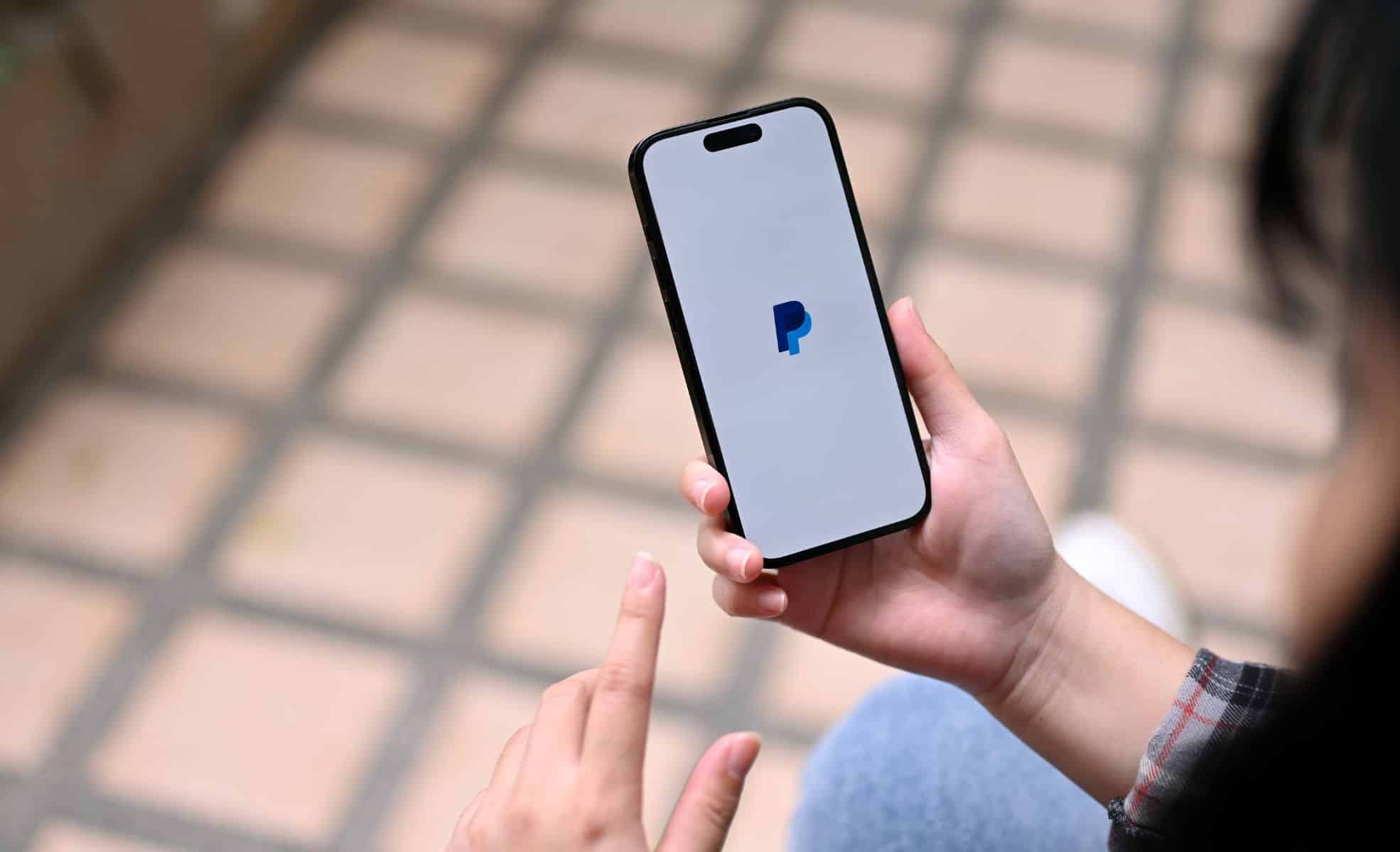 Person Using PayPal App on Phone