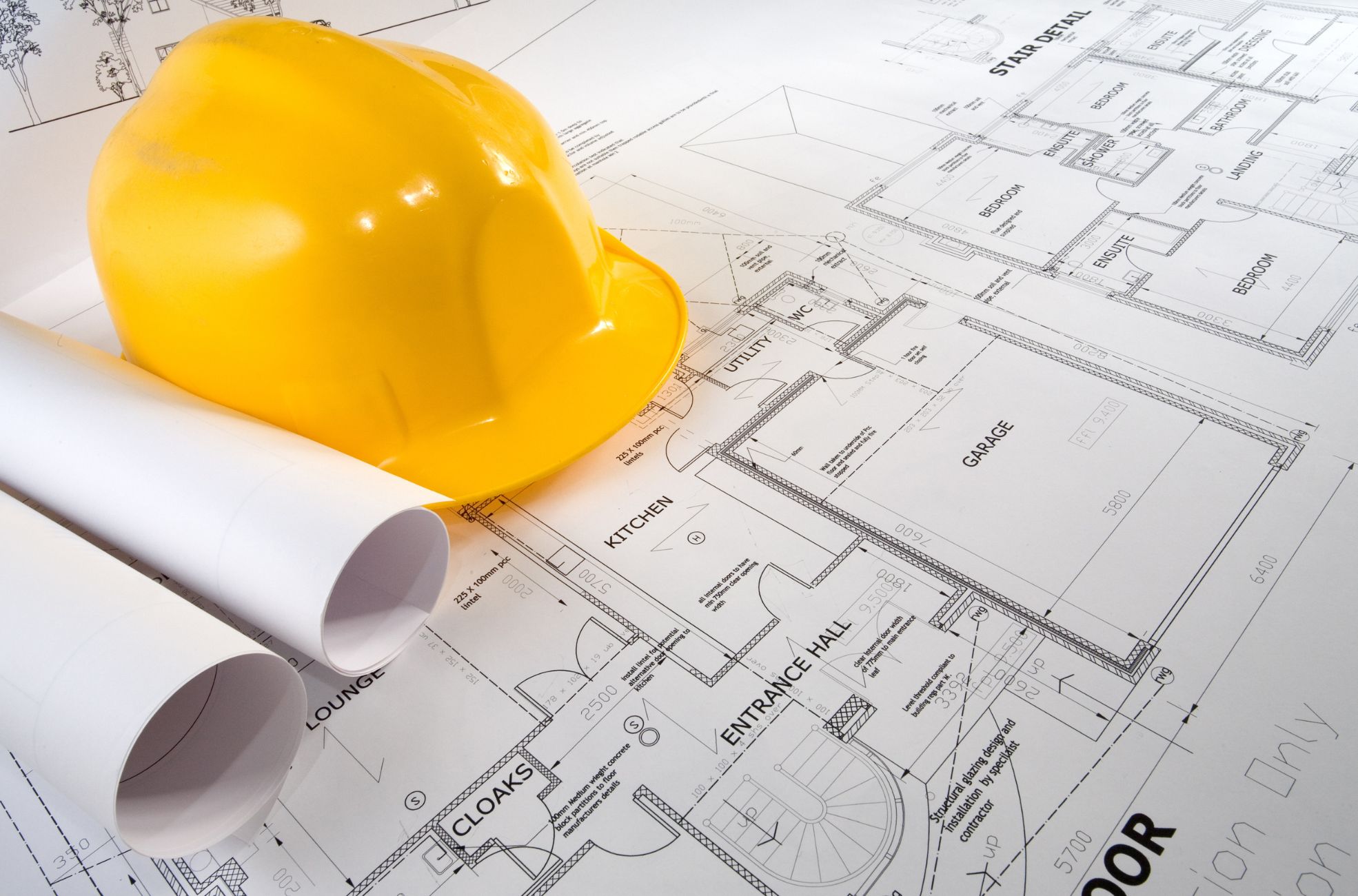 Construction Hat On Paperwork