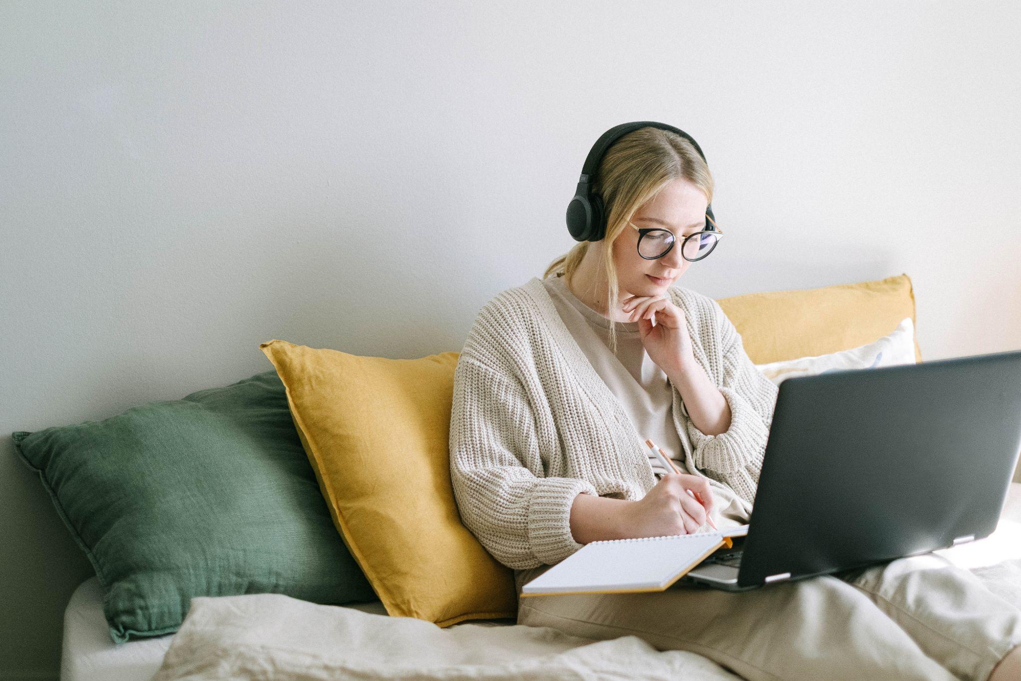 Stock Photo Blonde Woman Working On Laptop With Headphones
