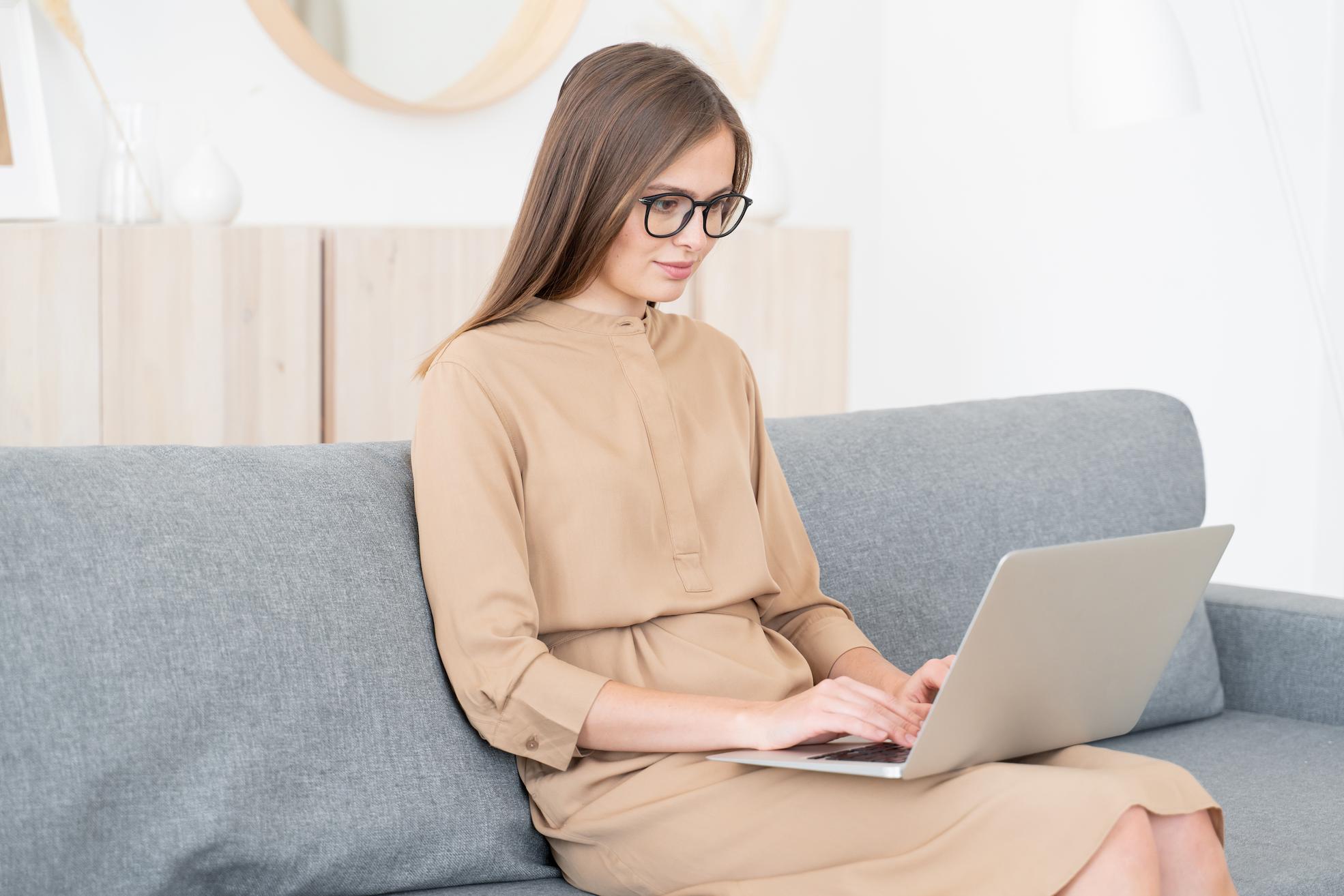 An image of a woman working from home with a home business licence in Dubai.
