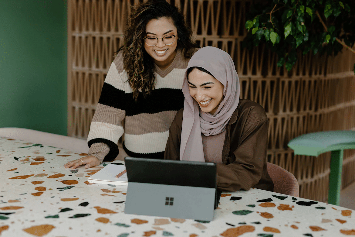 Stock image of two women doing business strategy planning on a tablet